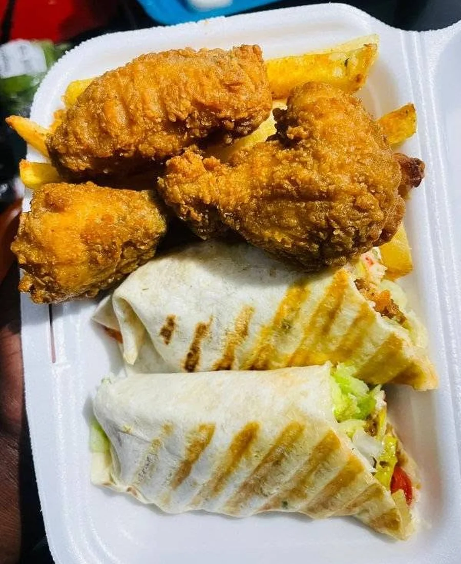 Fried chicken wings, chips and toasted wraps